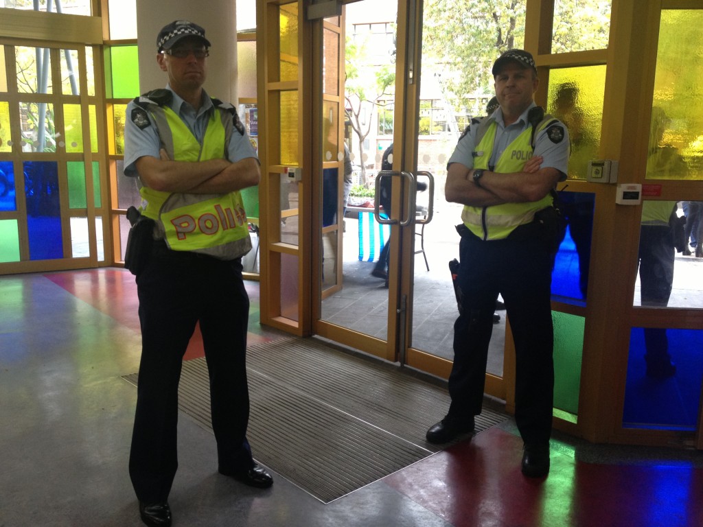 Two of the many policemen at a RMIT rally