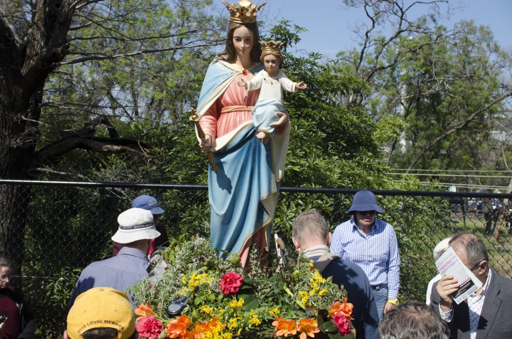 Anti-abortion protesors with a Jesus of Mary statue pray outside the clinic. Photo - Finbar O'Mallon