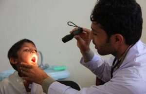 Young boy being examined by a doctor