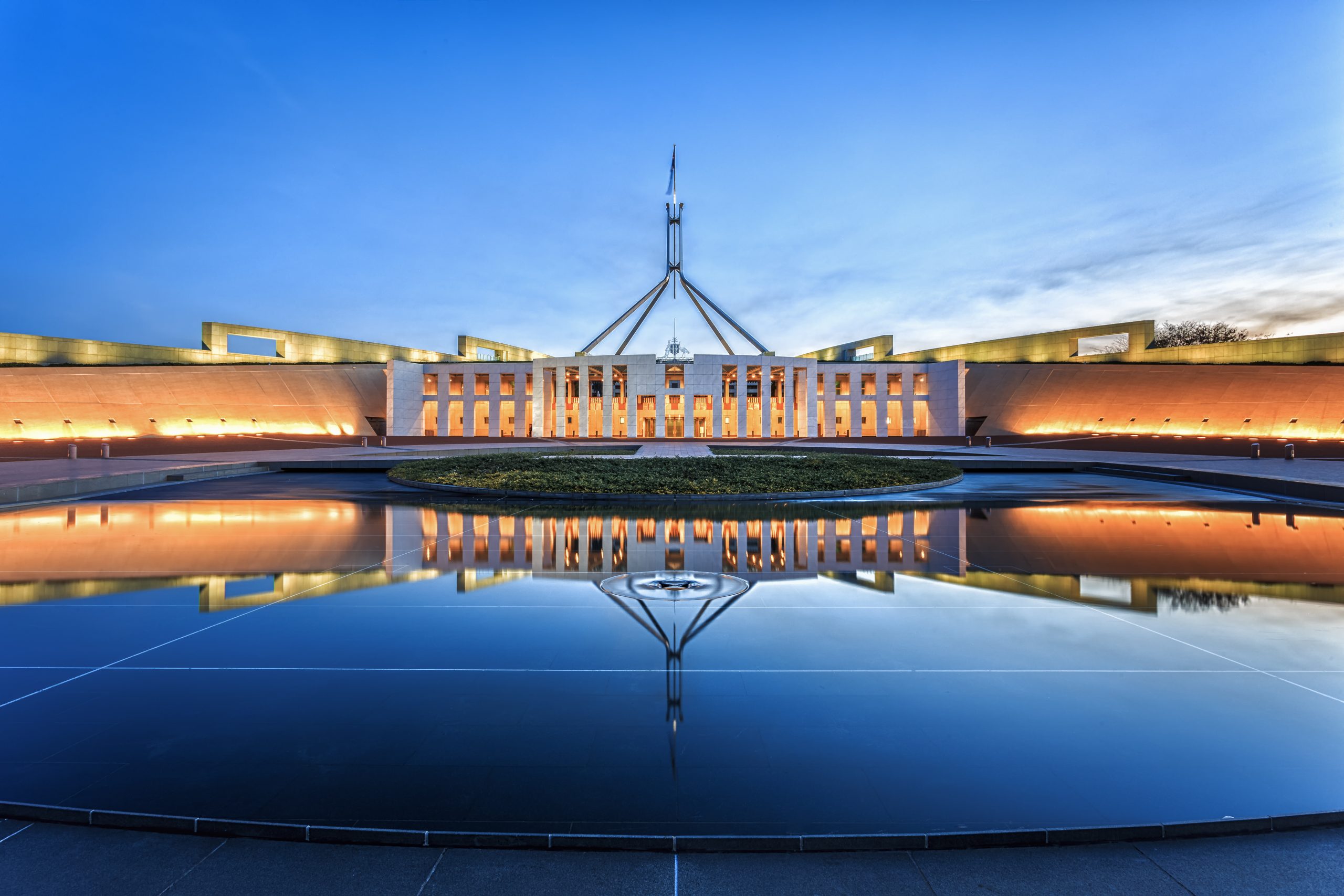 dramatic-evening-sky-over-parliament-house-illuminated-at-twilight