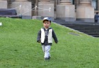 Boy playing on the Victorian State Library lawn