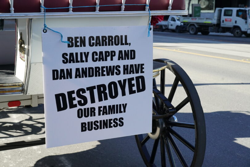 Sign on Horse Drawn Carriage criticising decision to ban