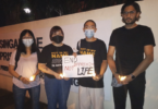 Kirsten Han and other advocates stand outside Changi Prison, Singapore, in April 2022 the night before an execution. Supplied: Kirsten Han.